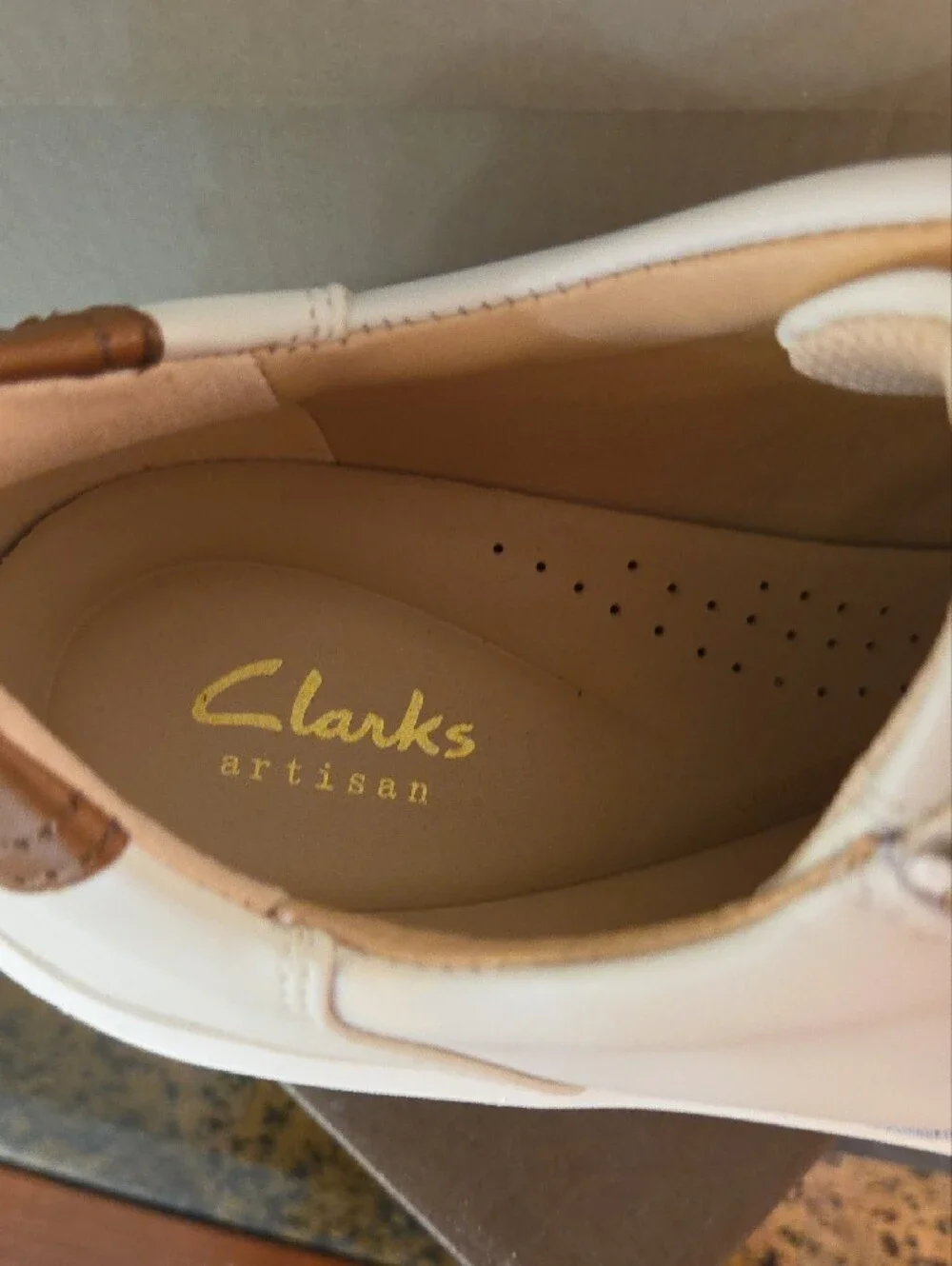 Clarks Cream Leather Sneakers with Brown Heel Accent and Gold Zip